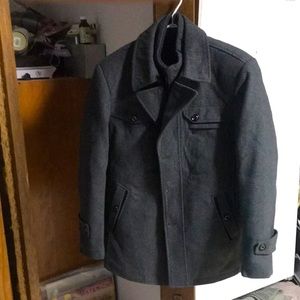 Businesses type over coat. Was ordered to small and I do not want it anymore